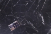 Matt black marble with golden and white veins